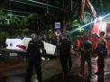 Mobil BMW Terbalik di Raya Merr Surabaya